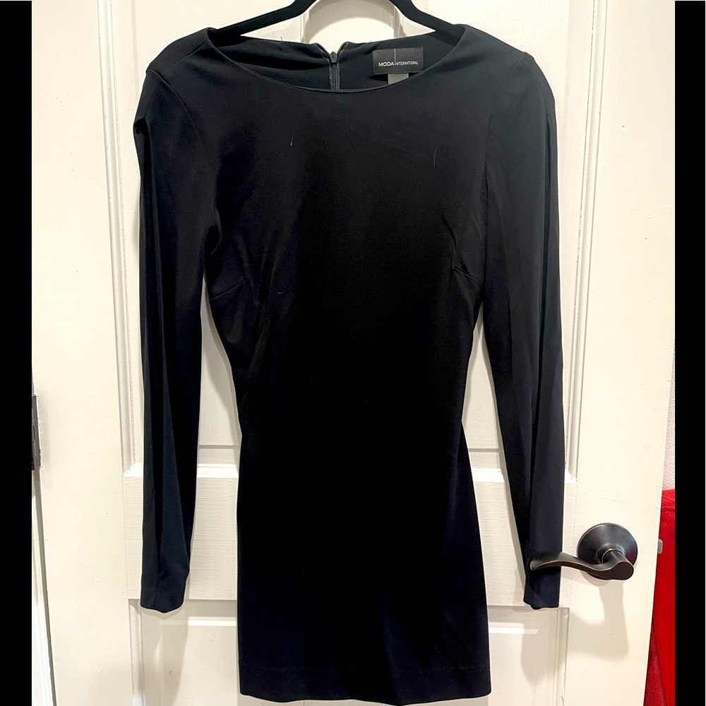 Adorable Moda International mini dress. Has peek-a-boo sleeves.